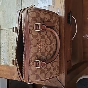 Tan brown saddle purse by coach